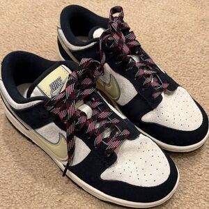 Nike Wimen’s Black, White, and Gold Sneakers